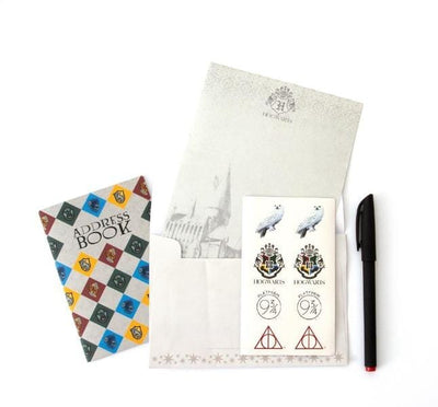 Harry Potter kids stationery set image showing an address book, envelope with paper, stickers and a pen.