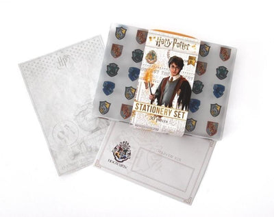 Harry Potter kids stationery set is shown in its travel case featuring Harry and all crests and shown with HP stationery paper and envelope.