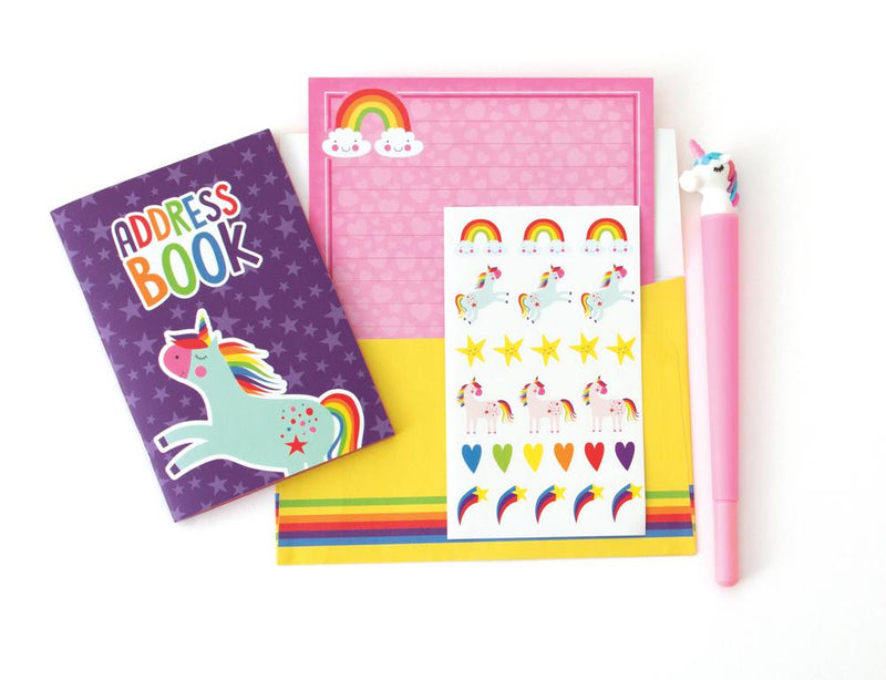 kids stationery set image showing a purple address book, pink stationery paper, a yellow envelope, a sticker sheet and a pink pen, all featuring rainbows and unicorns.