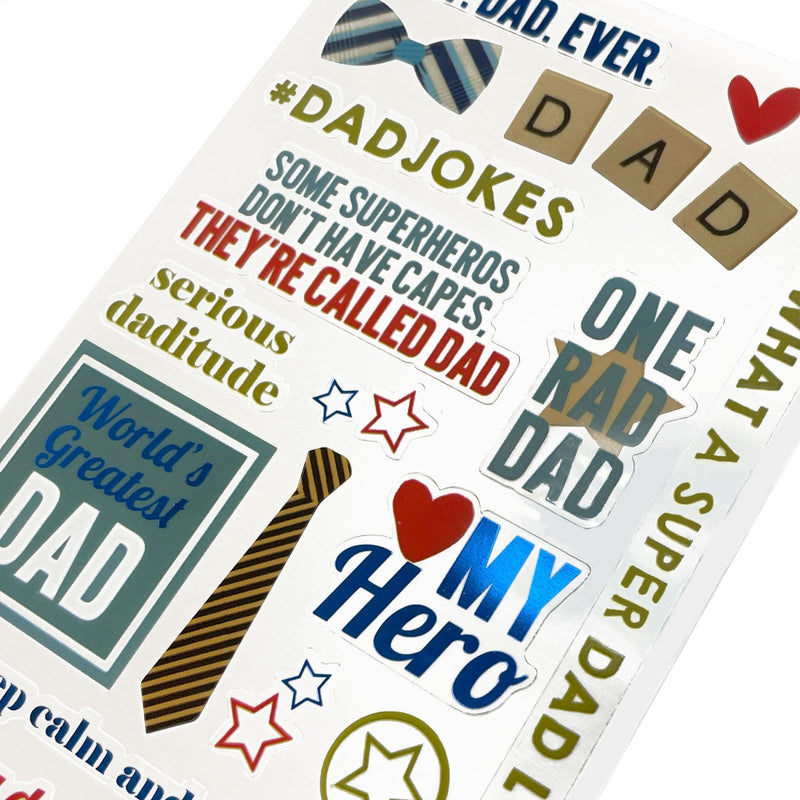 This image of scrapbook stickers shows the dad themed sticker sheet on an angle featuring sentiments of love with pink and gold details.
