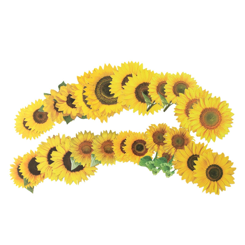 An assortment of scrapbook stickers featuring yellow sunflowers fanned out on a white background.