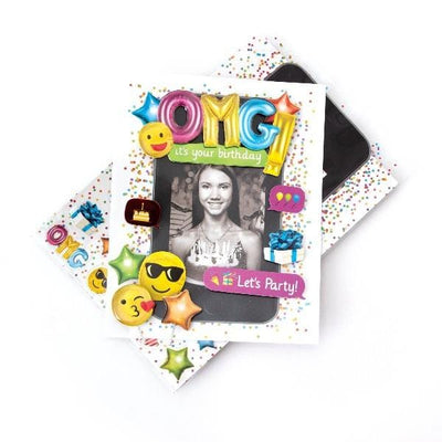 scrapbook stickers featuring a photo of a woman in a frame with colorful emoji birthday balloons shown over a sheet of clear stickers on a white background.