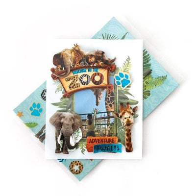 3D scrapbook stickers featuring a photo of a girl with a giraffe in a frame surrounded by zoo animals and greenery shown above a sheet of stickers on a white background.