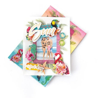 3D scrapbook stickers frame featuring a photo of a family at the beach surrounded by colorful flamingos and florals shown above a sheet of colorful stickers on a white background.
