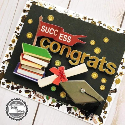 card featuring graduation stickers with gold and black details.