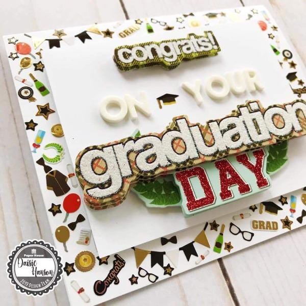 Card featuring graduation scrapbook stickers with white and gold details