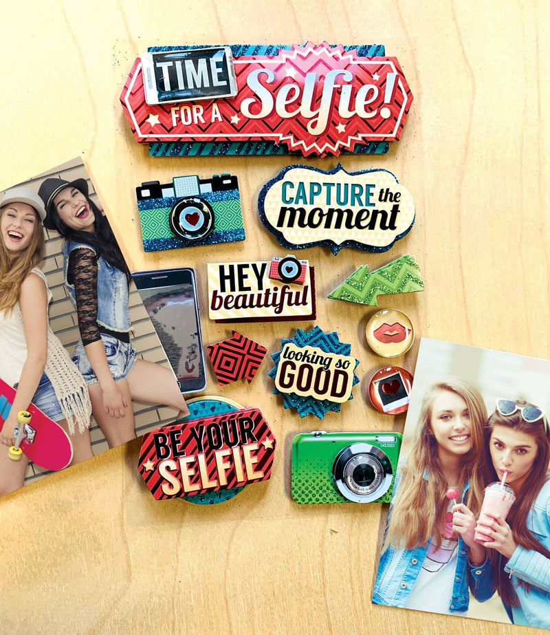 3D scrapbook stickers featuring colorful illustrations of cameras, cell phone and fun words shown between 2 photos of girls having fun on a wood surface.