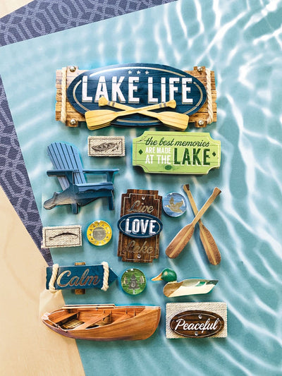3D scrapbook stickers featuring a lake life theme shown with blue patterned scrapbook  papers