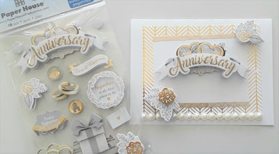 white and gold anniversary card made with 3D scrapbook stickers and pearl accents.