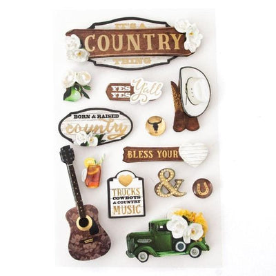 3D scrapbook stickers featuring cowboy boots and hat, a guitar and white flowers with wood details.