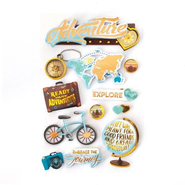 3D scrapbook stickers featuring adventure travel themes including the globe, a camera, luggage and a compass.