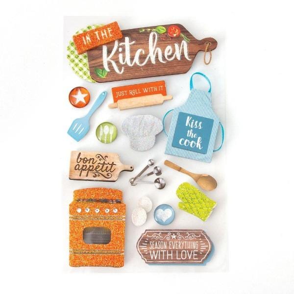 3D scrapbook stickers featuring kitchen utensils, apron and an orange glittered stove.