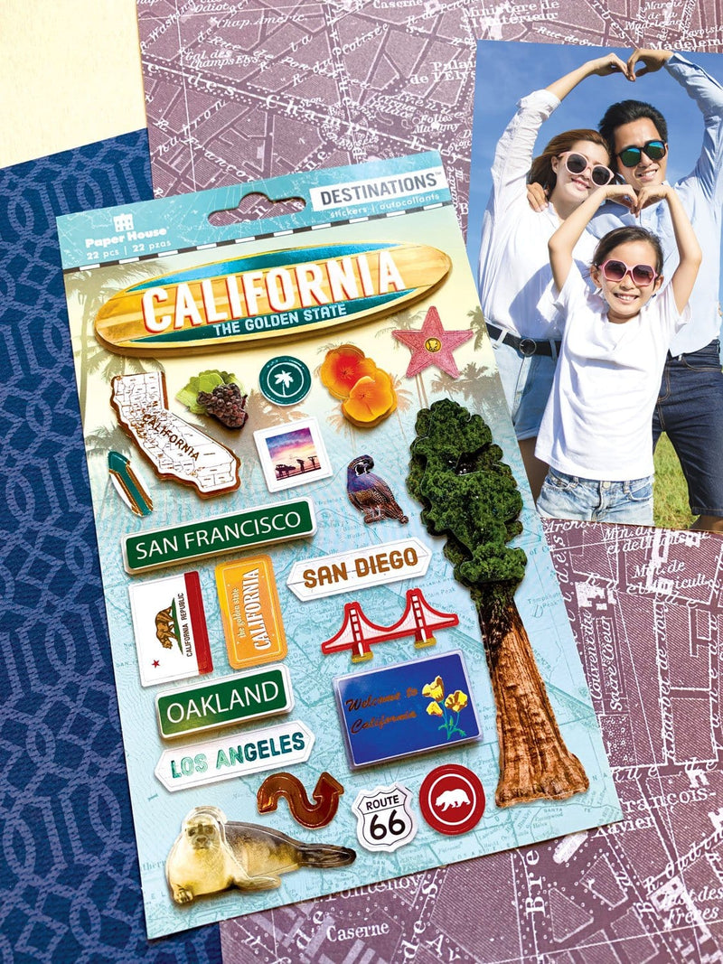 3D scrapbook stickers featuring California state and redwood tree shown next to photo of a family on a patterned paper background.