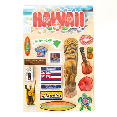 scrapbook stickers featuring Hawaii with hibiscus flowers, the state flag and a surf board on a beach scene background.