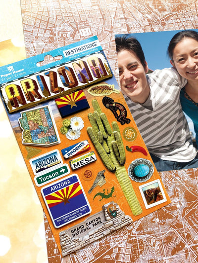 scrapbook stickers featuring Arizona with the state flag, cacti and road signs shown next to a photo of a young couple on a background of patterned papers.