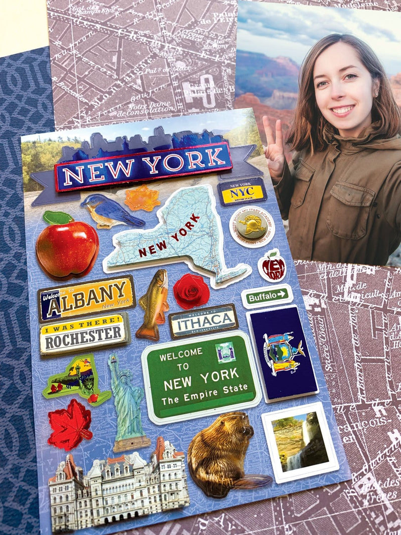 scrapbook stickers featuring New York State shown next to a photo of a woman on top of patterned papers.