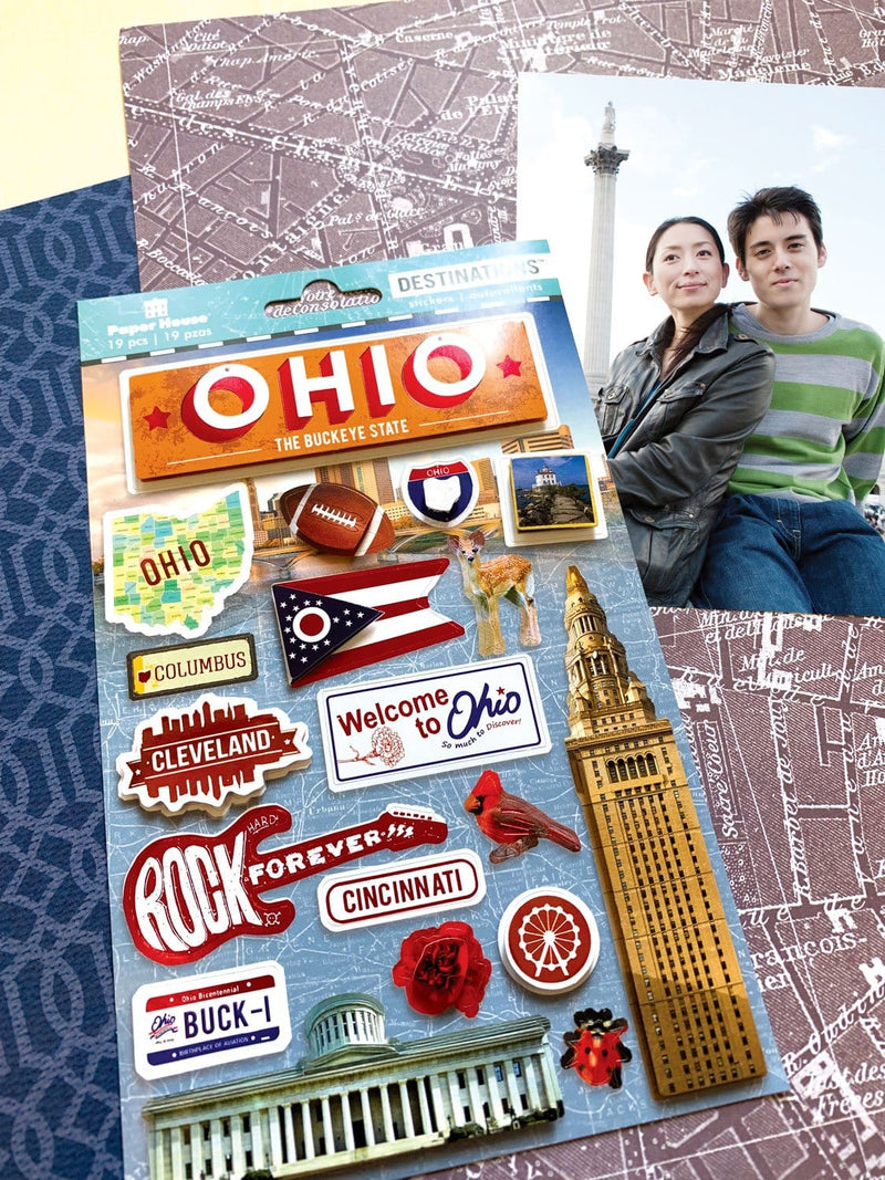 scrapbook stickers featuring Ohio shown next to photo of a young couple on a background of patterned papers.