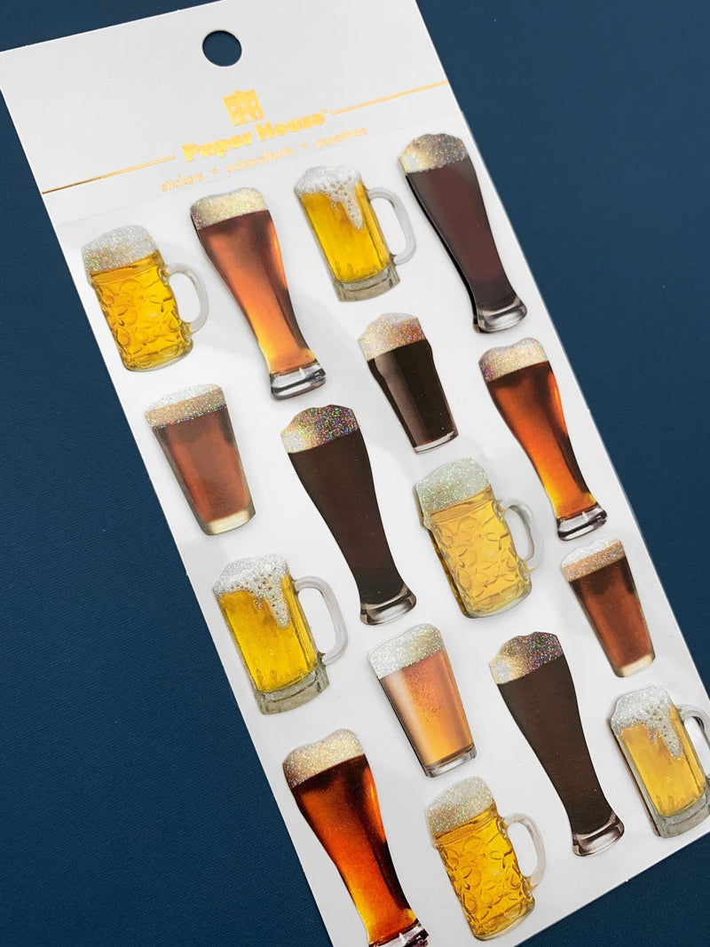 Scrapbook sticker featuring assorted mugs of beer. Cute stickers shown in white package on a dark blue background.