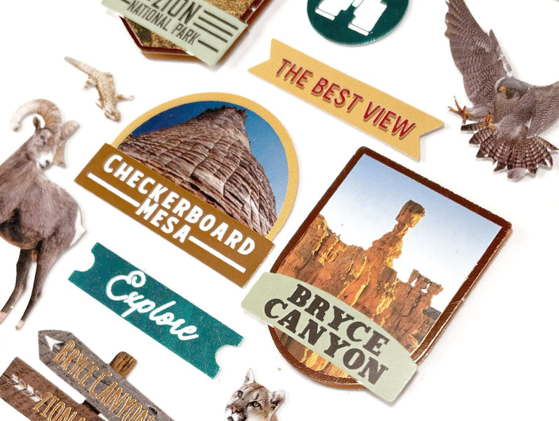 Close up of an assortment of scrapbook stickers featuring animals and scenes from US national parks.