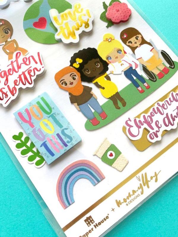3D scrapbook stickers featuring illustrations of a diverse group of women shown in package on a teal background. 