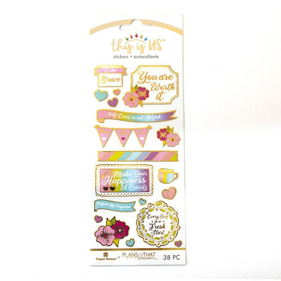 foil stickers featuring illustrated flowers, hearts and self-care illustrations with gold details, shown in package.