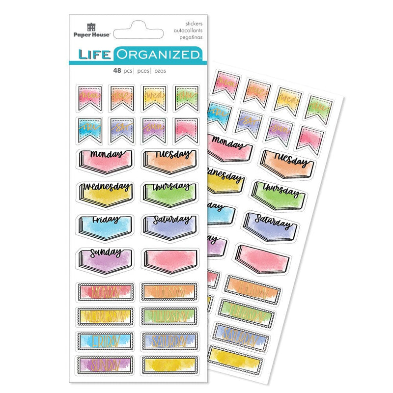 planner stickers featuring days of the week in lettering of gold and black with colorful watercolor washes, shown in package overlapping another sheet on a white background.