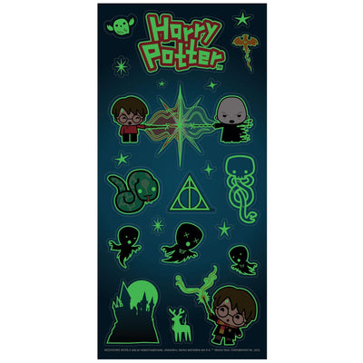 harry potter stickers featuring chibi charms in green glow in the dark outlines on dark blue, shown on white background.