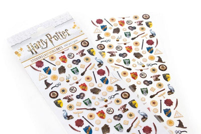 micro stickers shown in package featuring Harry Potter ™ crests, sorting hats and symbols shown overlapping another sheet of stickers on an angle on a white background.