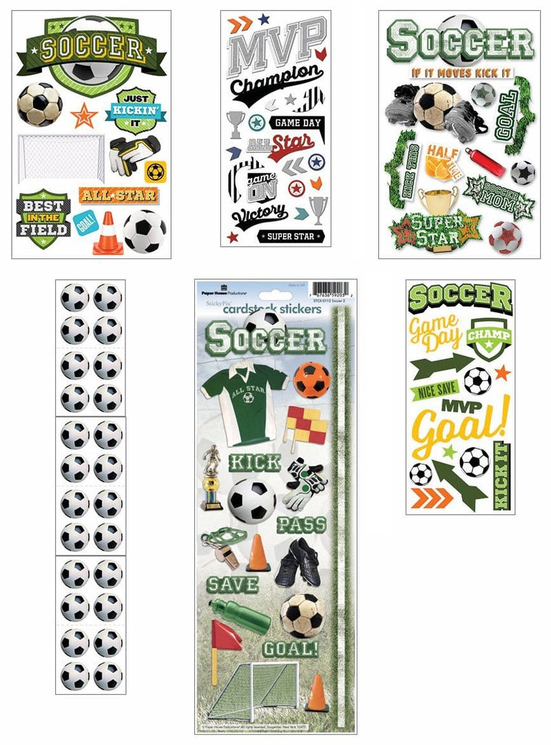 An assortment of soccer scrapbook stickers featuring words, uniforms, cones and soccer balls with silver foil shown layered on a white background.