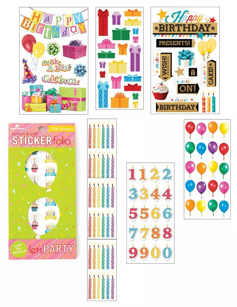 An assortment of happy birthday themed scrapbook stickers featuring words, presents, numbers, candles and balloons with gold foil and clear glitter details shown layered on a white background.