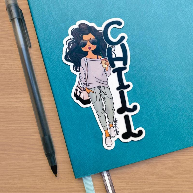 Shaped laptop sticker featuring an illustration of a brunette Lady D with the black letters CHILL stacked beside her, shown on a blue notebook with a black ballpoint pen beside it.