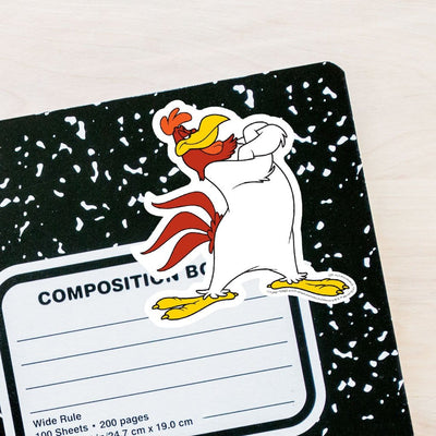 vinyl laptop sticker featuring a diecut Foghorn Leghorn adhered to the front of a black and white composition notebook.