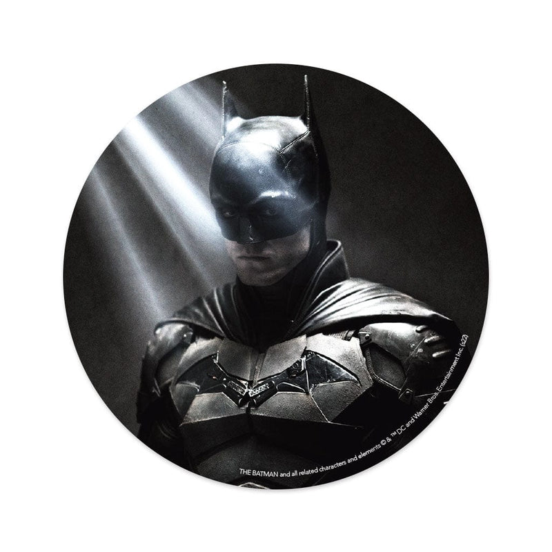 round vinyl sticker featuring a portrait of Batman in the light shown on a white background.