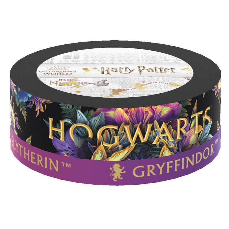 Two rolls of washi tape are shown in packaging featuring HOGWARTS in gold lettering on a jewel-toned, floral background and a purple roll with gold lettering.