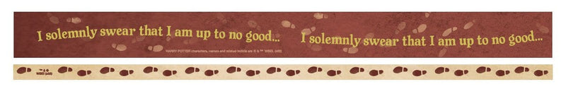 Two strips of washi tape are shown featuring "I solemnly swear…" gold lettering on rust colored background on one and a beige roll with rust colored footprints on the other.