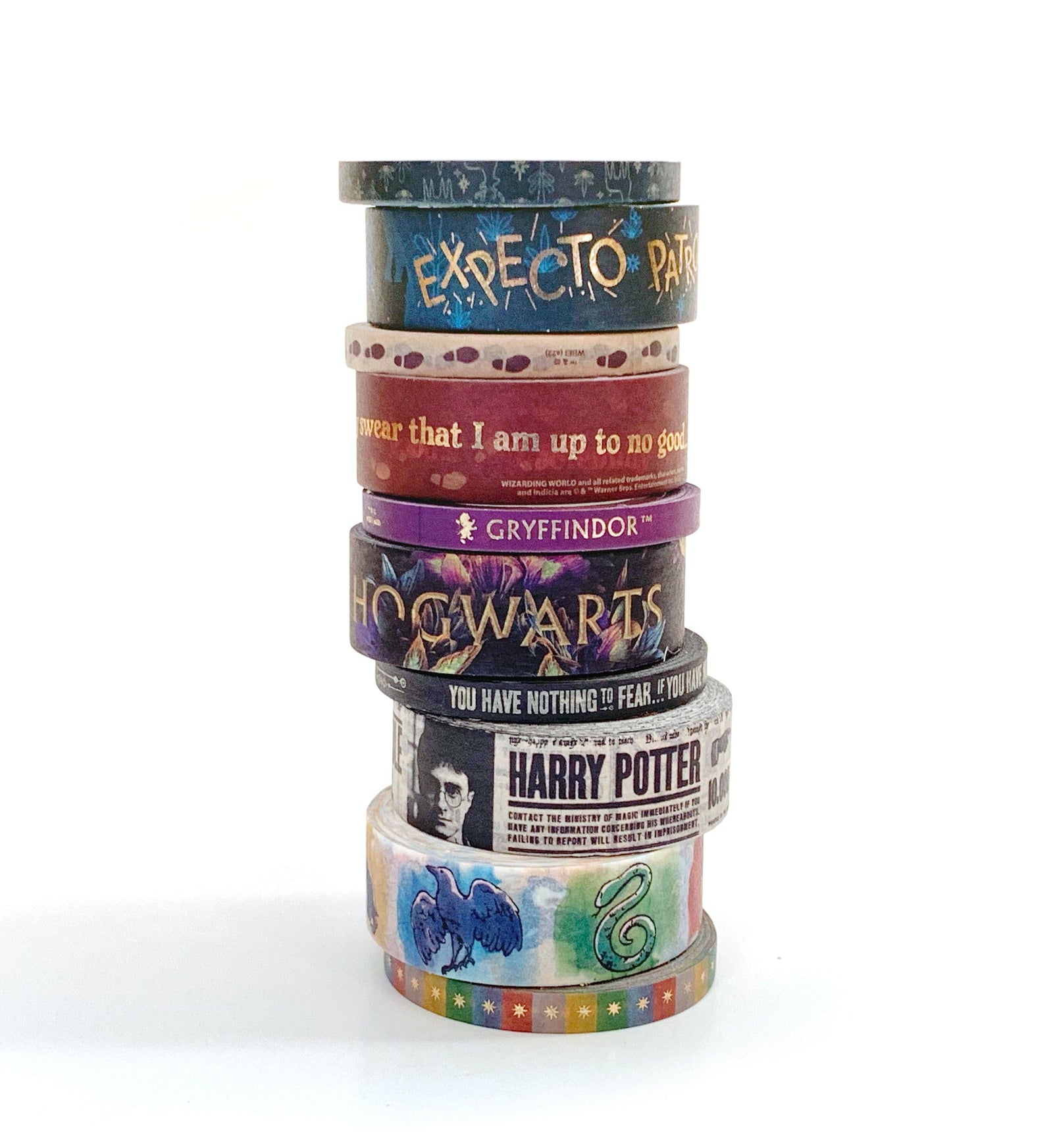 10 rolls of colorful harry potter washi tape shown stacked against a white background.