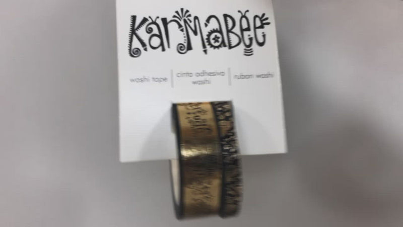 Hands show washi tape set in package featuring words of gratitude in gold and black.