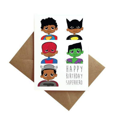 birthday card featuring illustrated super heroes by Ms. James is shown with envelope on white background.