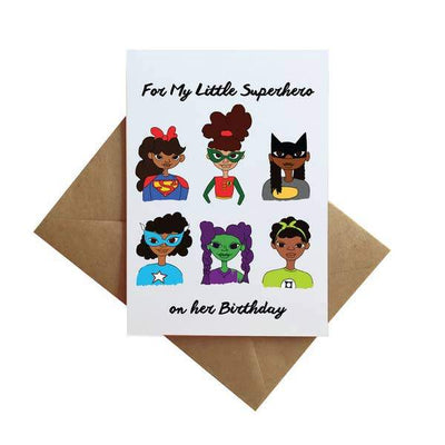 note card featuring illustrations of 6 women superheros, shown with brown envelope on white background.