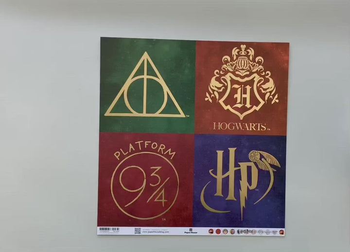 Female hands display Harry Potter scrapbook paper featuring Icons with gold details one one side, and a chibi character pattern on the reverse.