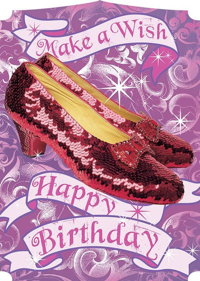 birthday note card featuring photo real ruby slippers on a purple and pink patterned background.