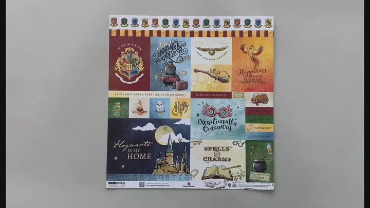 female hands pick up and show both sides of harry potter scrapbook paper featuring watercolor tags.