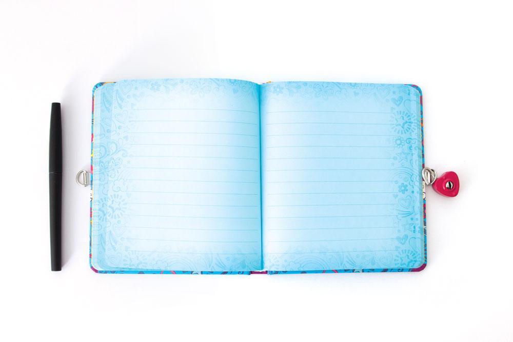 Golden Puppy Doodles locking diary shown open featuring light blue lined pages and a black pen.