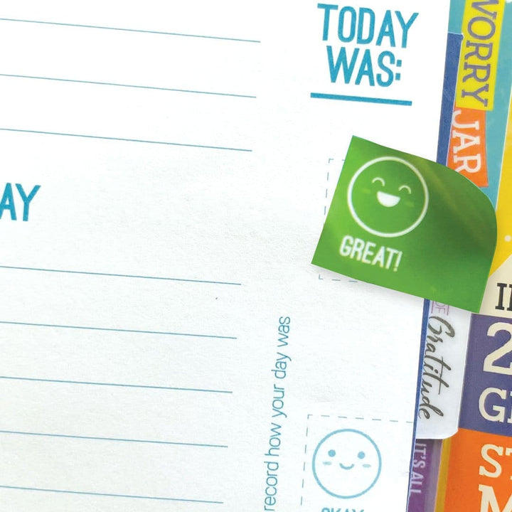 kids journal featuring a close up of a GREAT sticker applied to a lined page.