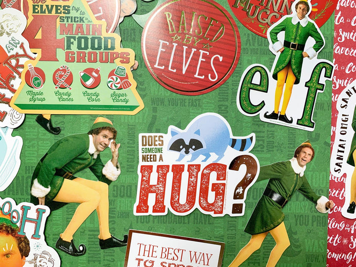 Craft kit featuring close up of die cuts shown on green scrapbook paper, all of scenes and characters from the movie Elf.