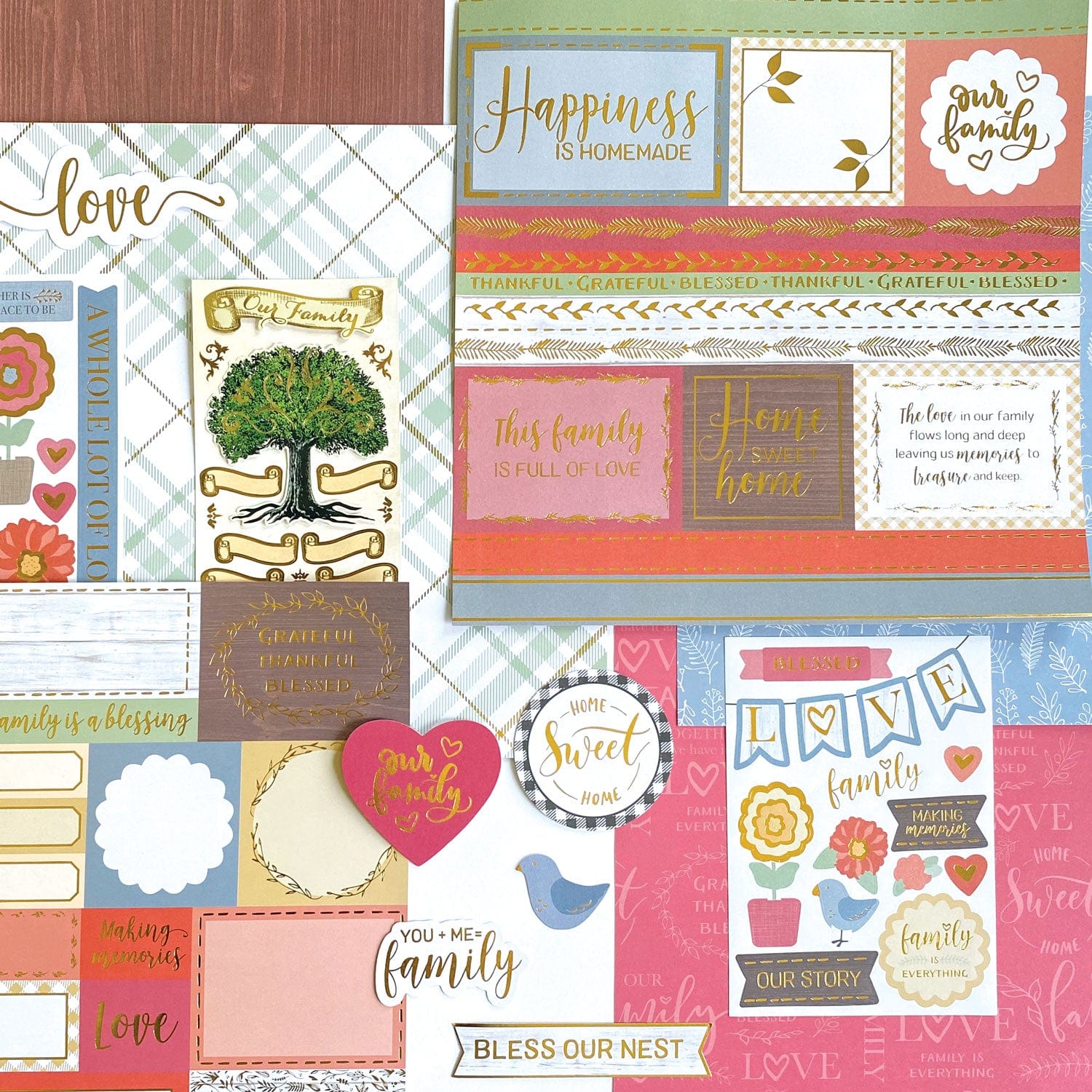 KIT-0134E - Craft Kit - Our Family - Colorful scrapbooking craft kit with family-themed stickers, cardstock, and decorative elements in coral, gold, and blue tones