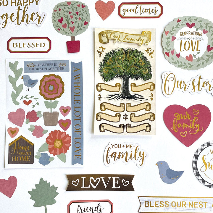 KIT-0134E - Craft Kit - Our Family - Assorted family-themed die-cut stickers featuring hearts, trees, birds, flowers, and gold text phrases on cream, burgundy, and sage backgrounds
