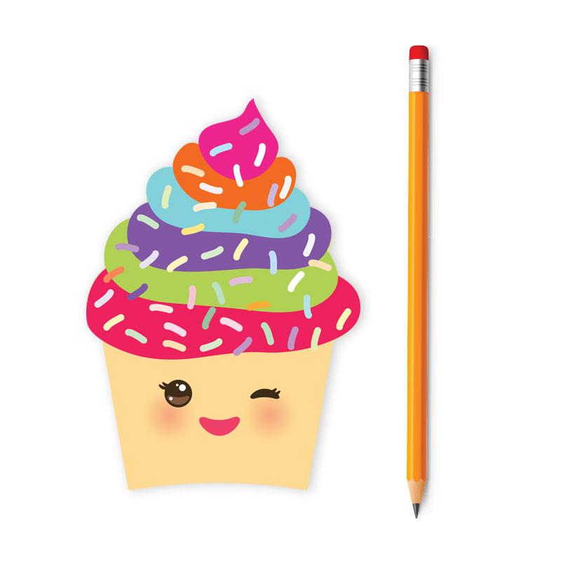 die cut mini notebook featuring a colorful, illustrated cupcake with a face on it, shown with pencil on white background.