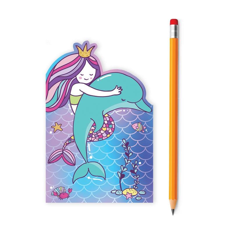 die cut mini notebook featuring an illustrated mermaid and her dolphin, shown with pencil on white background.