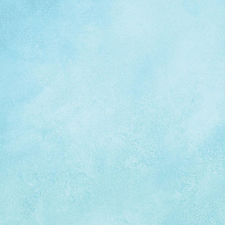 scrapbook paper featuring a blue watercolor pattern.